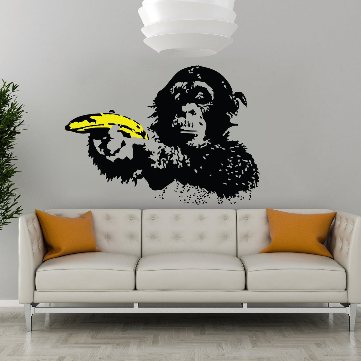 Banksy Monkey Wall Sticker depicting a monkey with a banana, adding urban art to home decor.