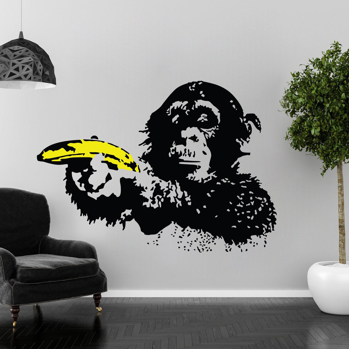 Banksy monkey wall sticker vinyl decal featuring a monkey holding a banana in a stylish interior setting.