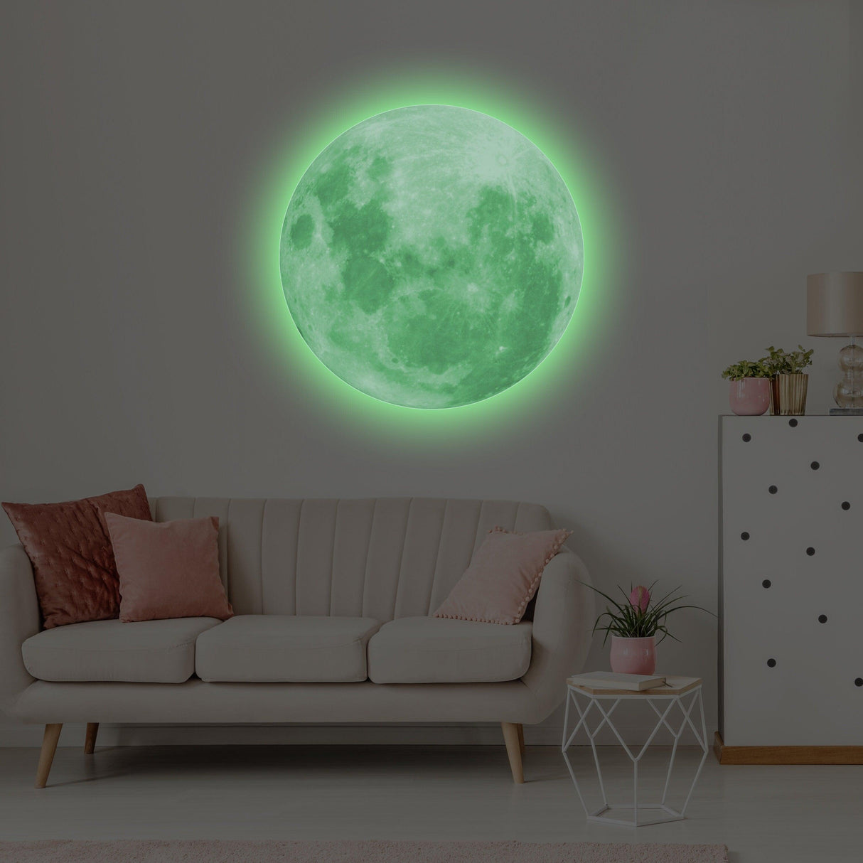 Glow in the dark moon wall sticker illuminating a cozy living room, adding a magical touch to home decor.