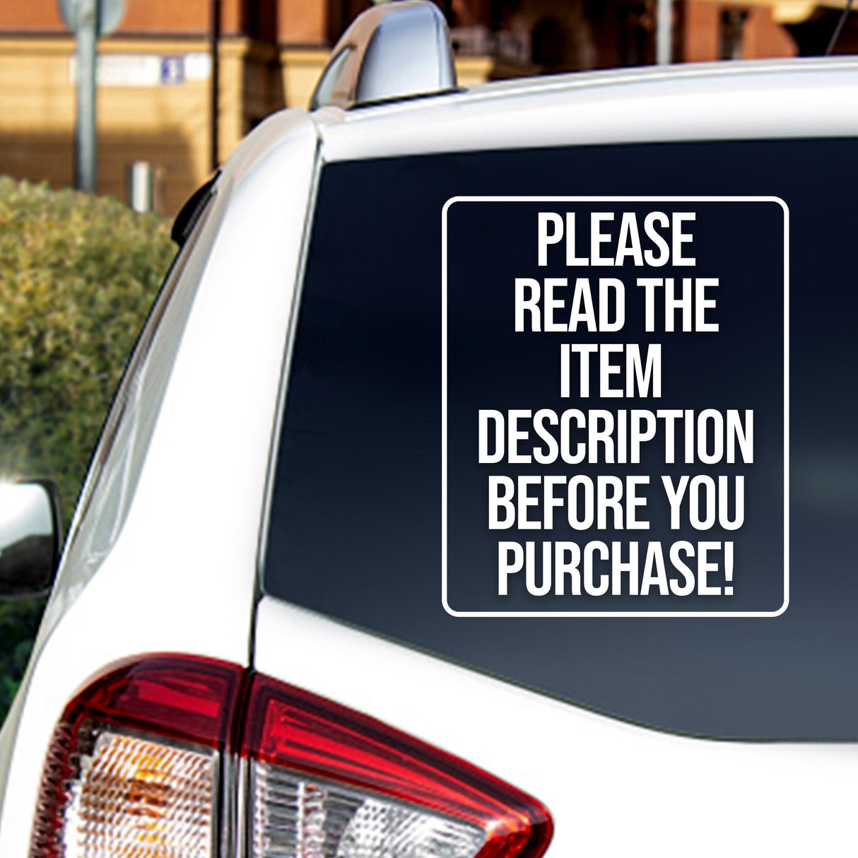 Car window with a decal that reads 'Please read the item description before you purchase!'.