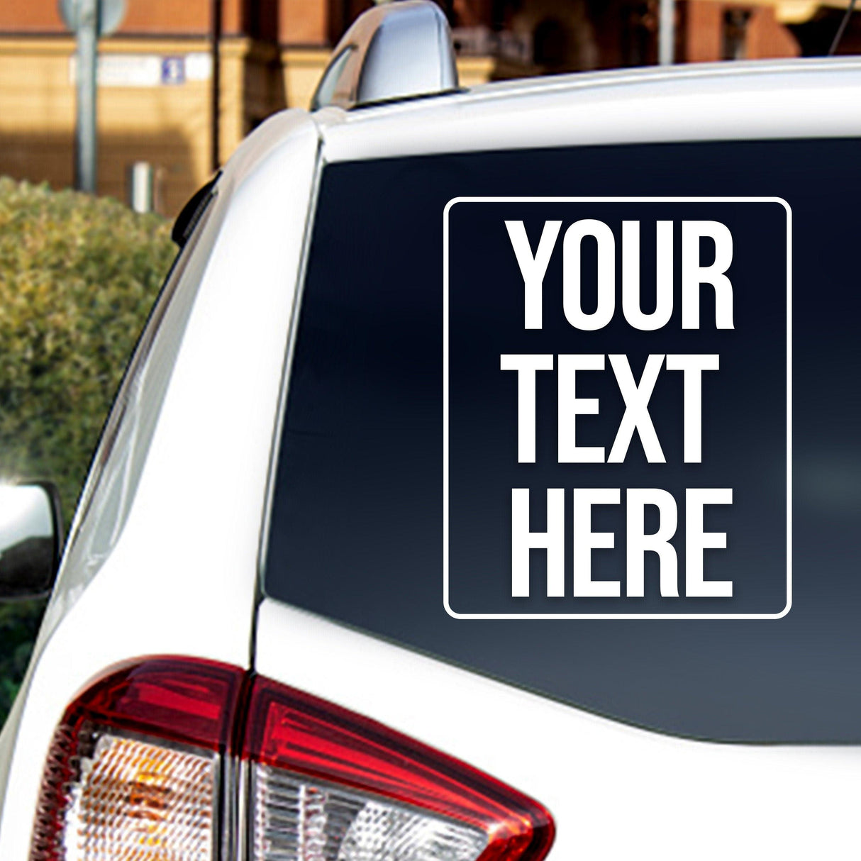 Custom car window decal on a vehicle showing placeholder text for personalized design.
