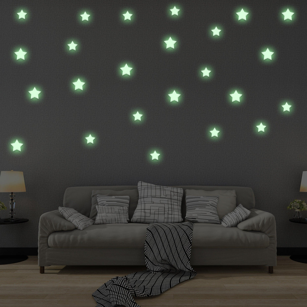 Glow in the dark star stickers on a wall above a cozy sofa, creating a magical starry atmosphere for a child's room.
