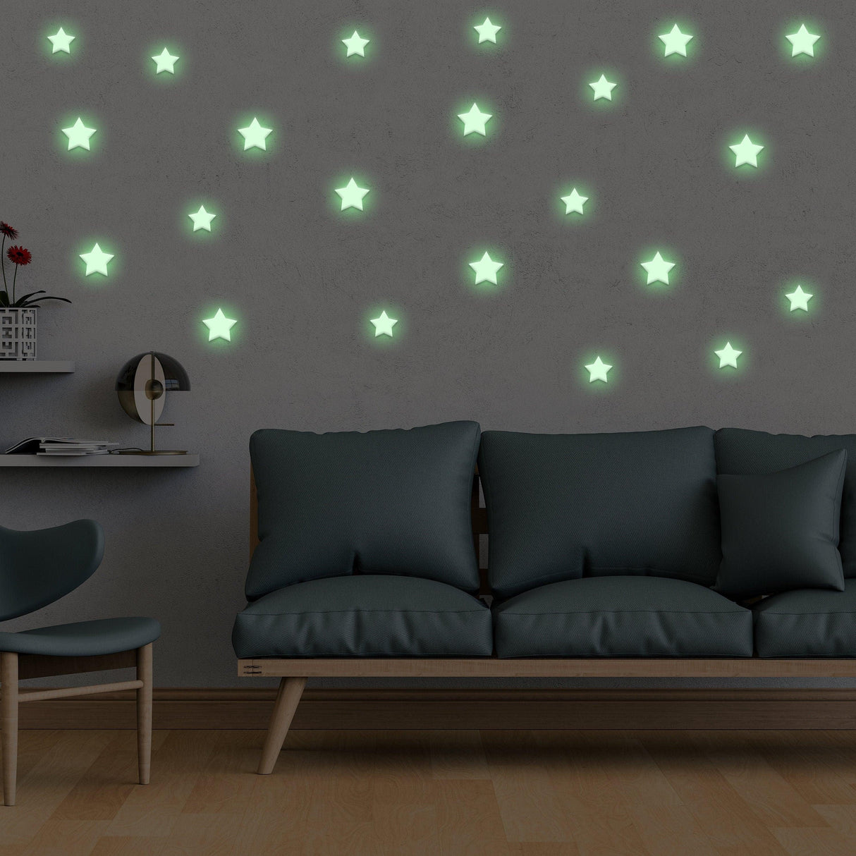 Glow in the dark star stickers on a wall above a cozy sofa, perfect for children's room decor.