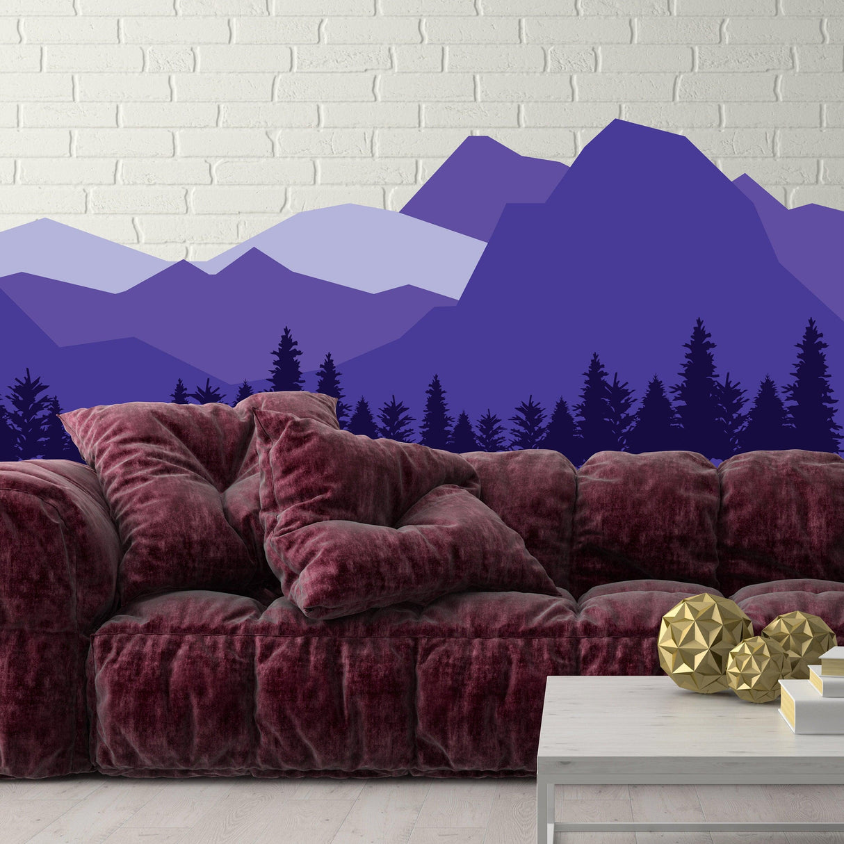 Mountain wall decal in purple tones above a plush maroon sofa, perfect for a nursery or child's room decor.