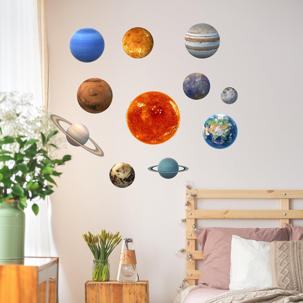 Glow in the dark solar system wall decals featuring planets and sun in a cozy bedroom setting.