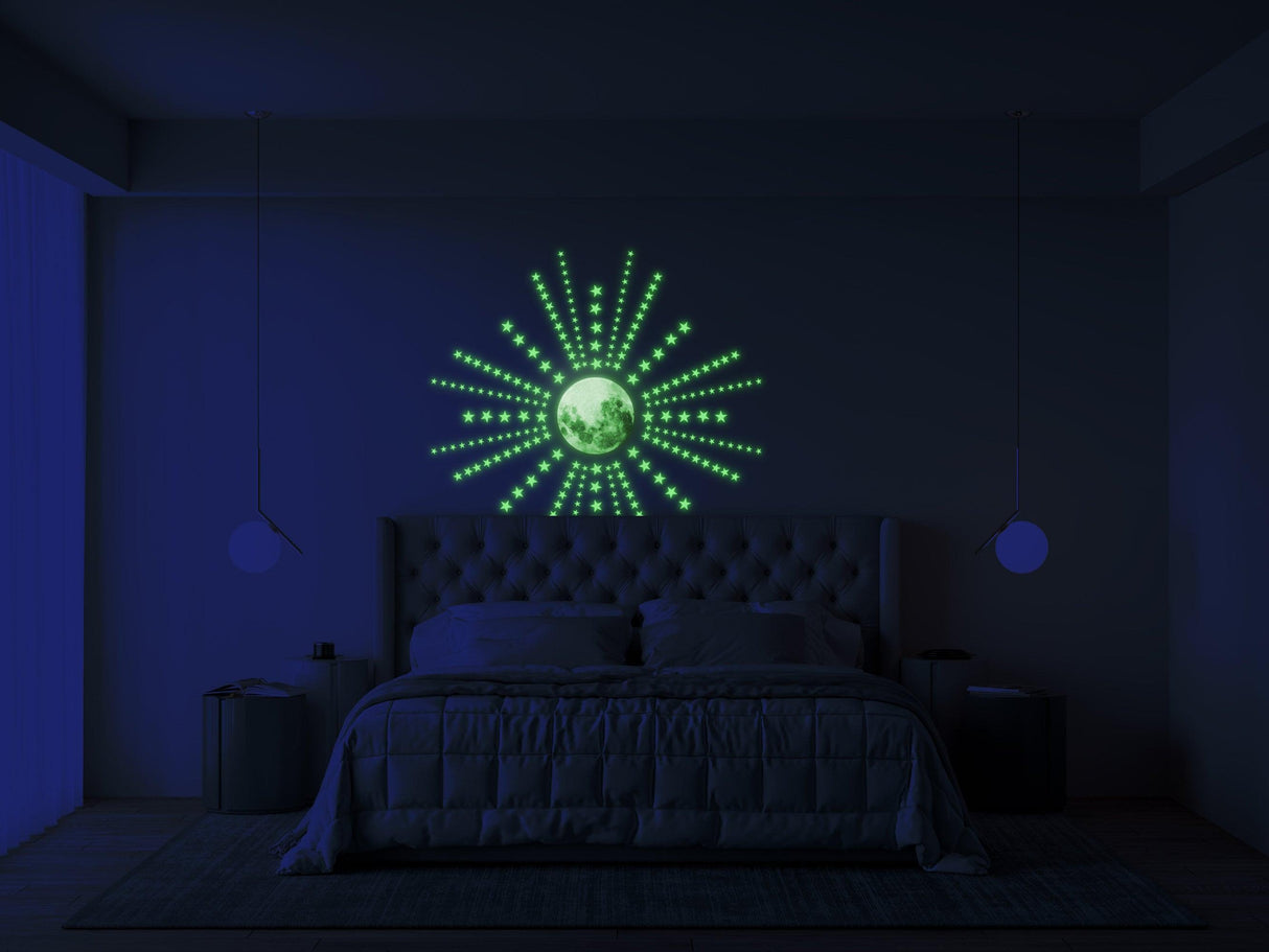 Glow in the dark moon and star stickers illuminating a modern bedroom for a magical nighttime atmosphere.