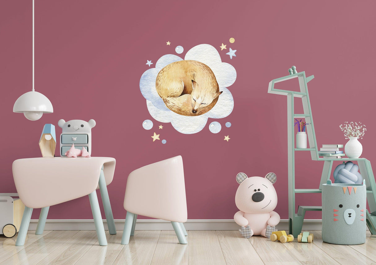 Cute animal wall sticker featuring a sleeping fox among fluffy clouds and stars in a baby nursery room.