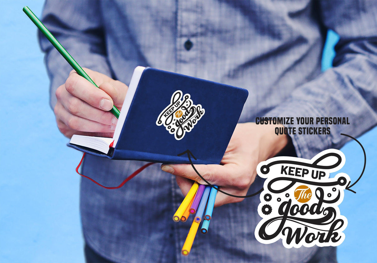 Person holding a notebook with colorful pens, featuring customizable quote stickers for personal touch.
