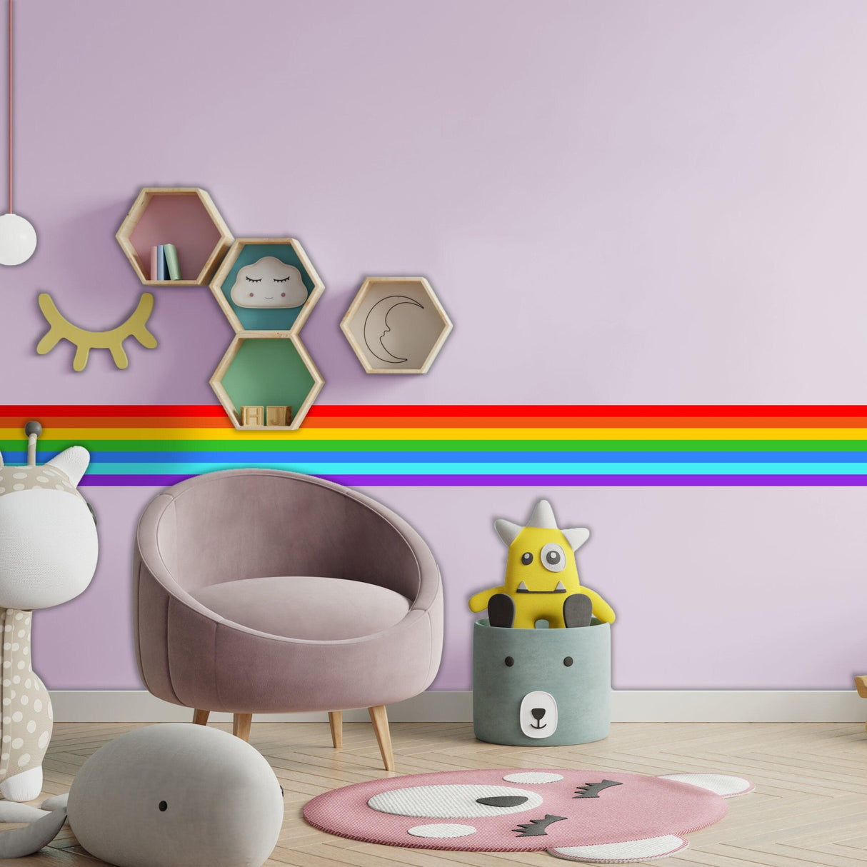 Bright nursery featuring a rainbow stripe vinyl decal on a wall, with cute toys and modern decor elements.