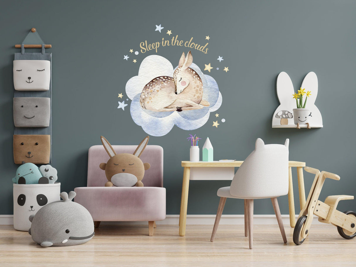 Baby nursery featuring dreamy wall sticker of deer, clouds, and playful decor for a charming kids' room.