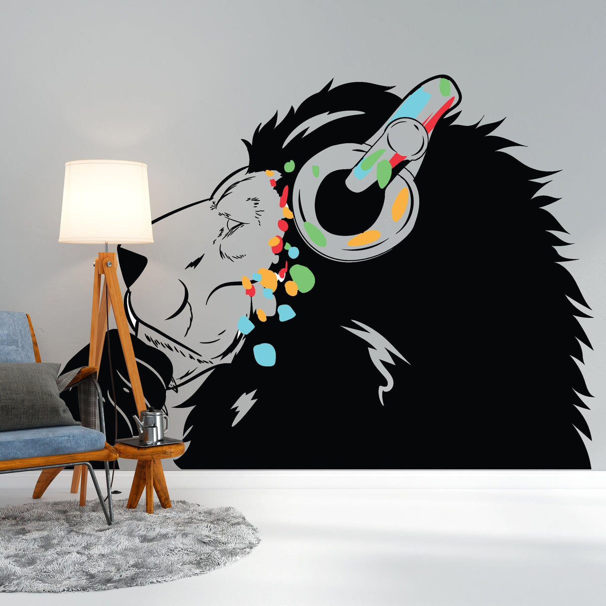 Thinking Lion Sticker, Banksy-inspired vinyl wall decal featuring a lion with headphones and colorful spray paint accents.