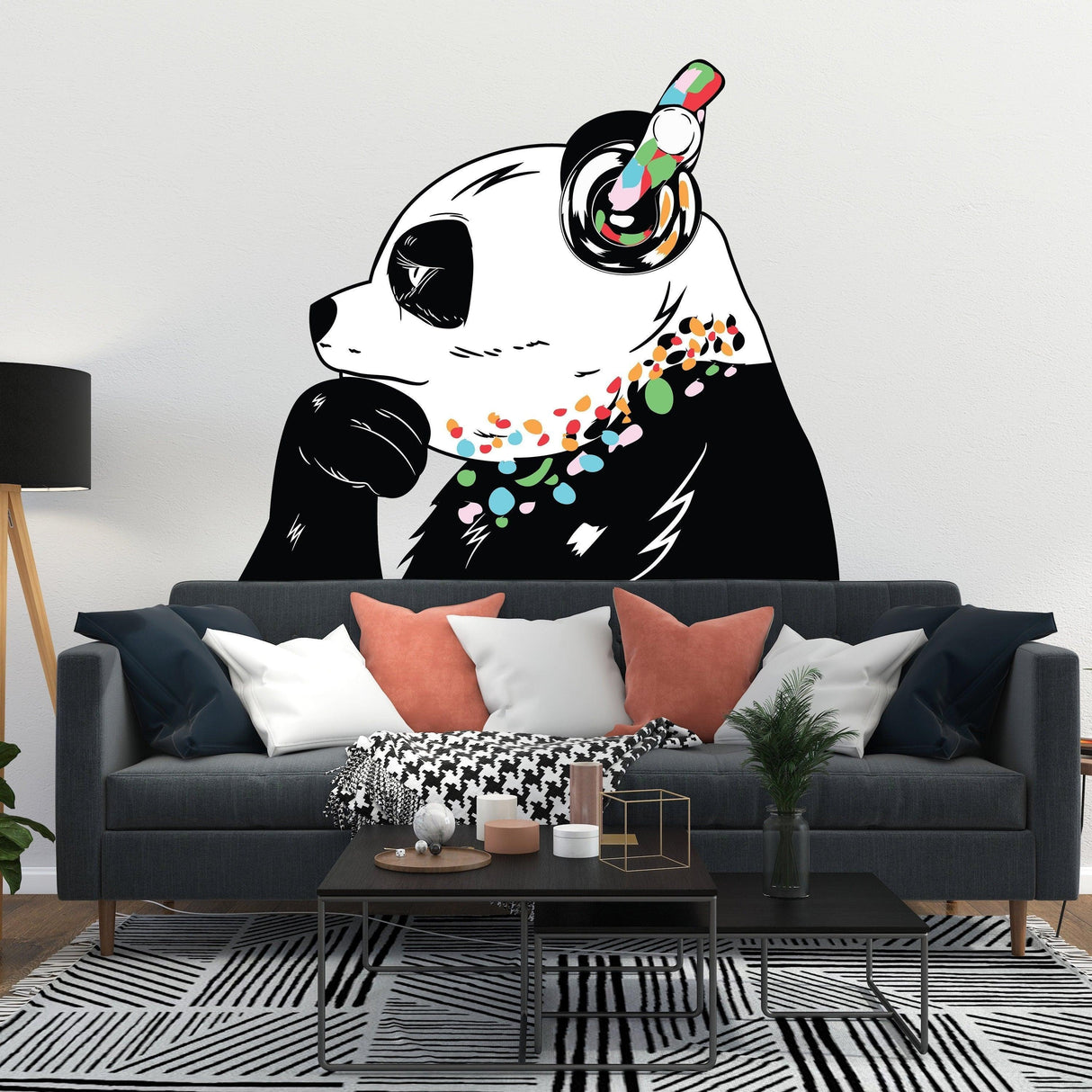 Vinyl decal of a panda bear with headphones, adding creativity to a modern living room decor.