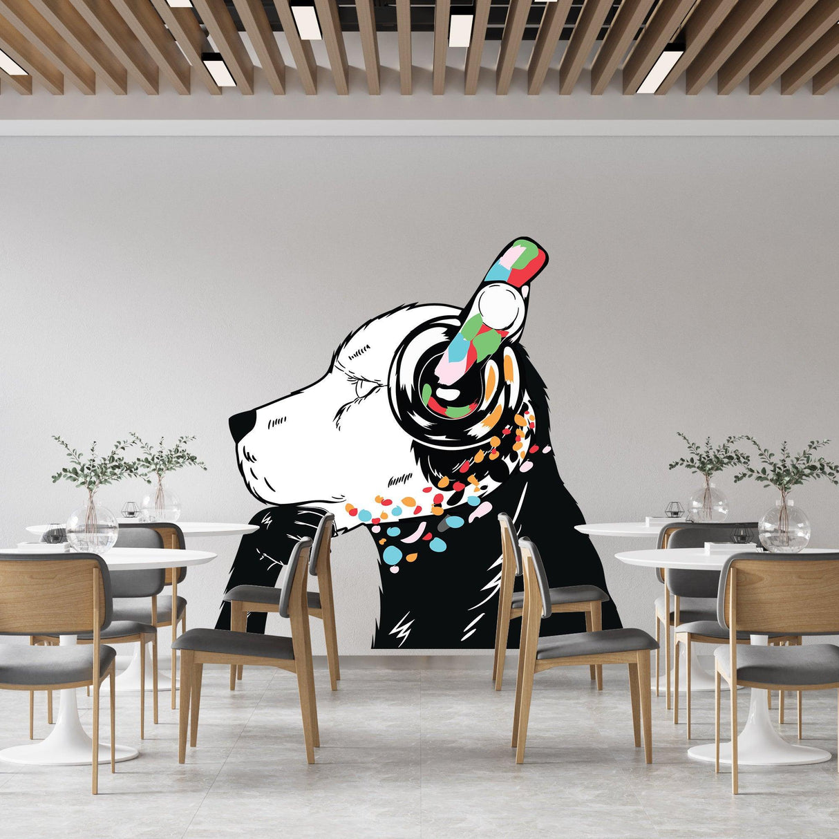 Stylish wall decal of a dog wearing colorful headphones in a modern dining area.