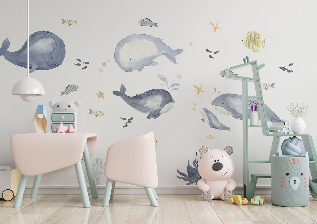 Sea whales wall sticker in a kids room, fish theme decor for baby boy nursery, playful and charming design.
