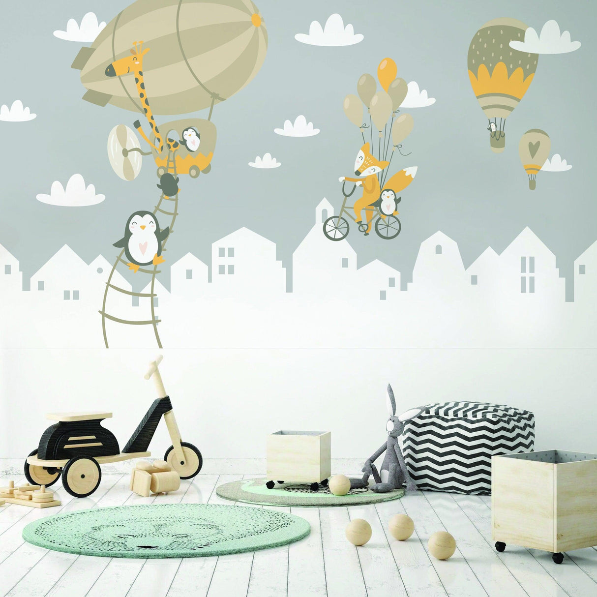 Playful penguins and fox wall stickers with balloons in a kids' nursery decor, ideal for children’s room transformation.