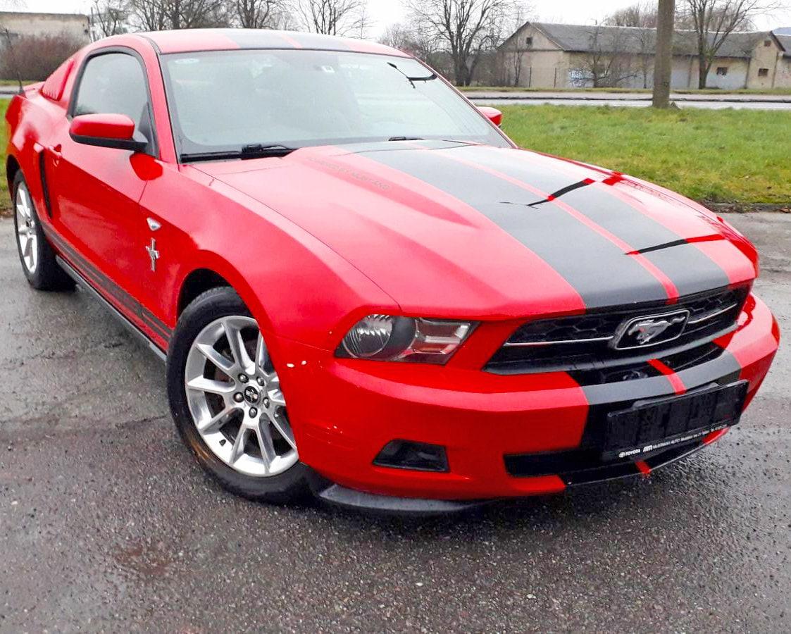Red Mustang with two lines racing stripes showcasing sporty decals for RT models.