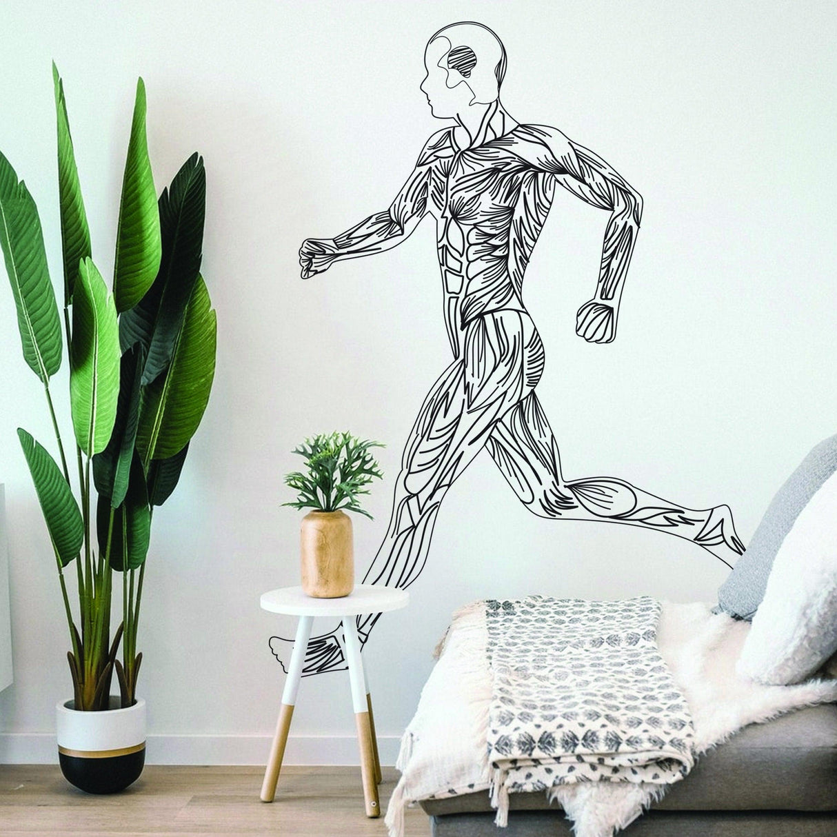 Sleek black silhouette wall decal of a running figure, perfect for gym or home workout decor.