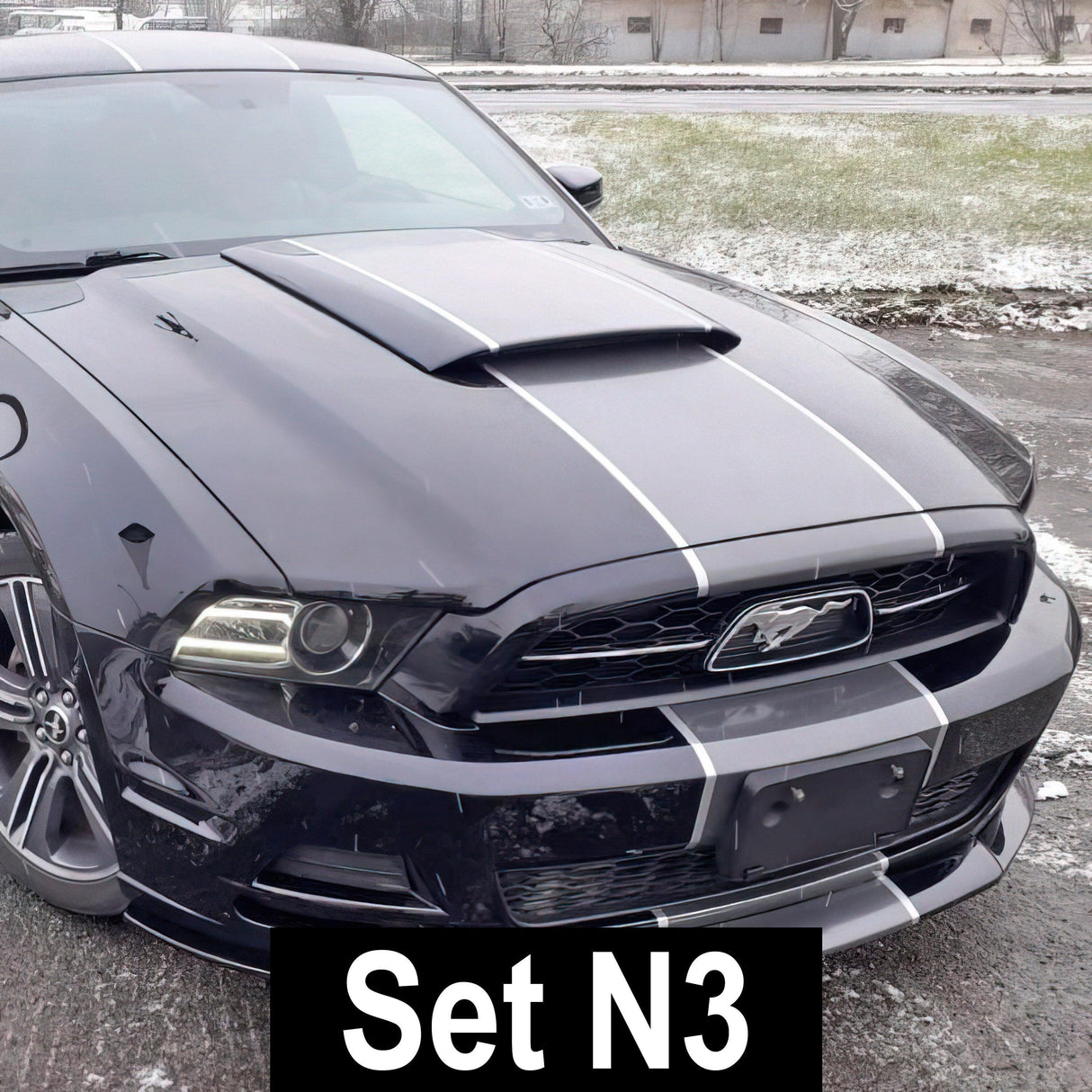 Racing stripes vinyl decals on a sleek black car, enhancing its sporty look and style.