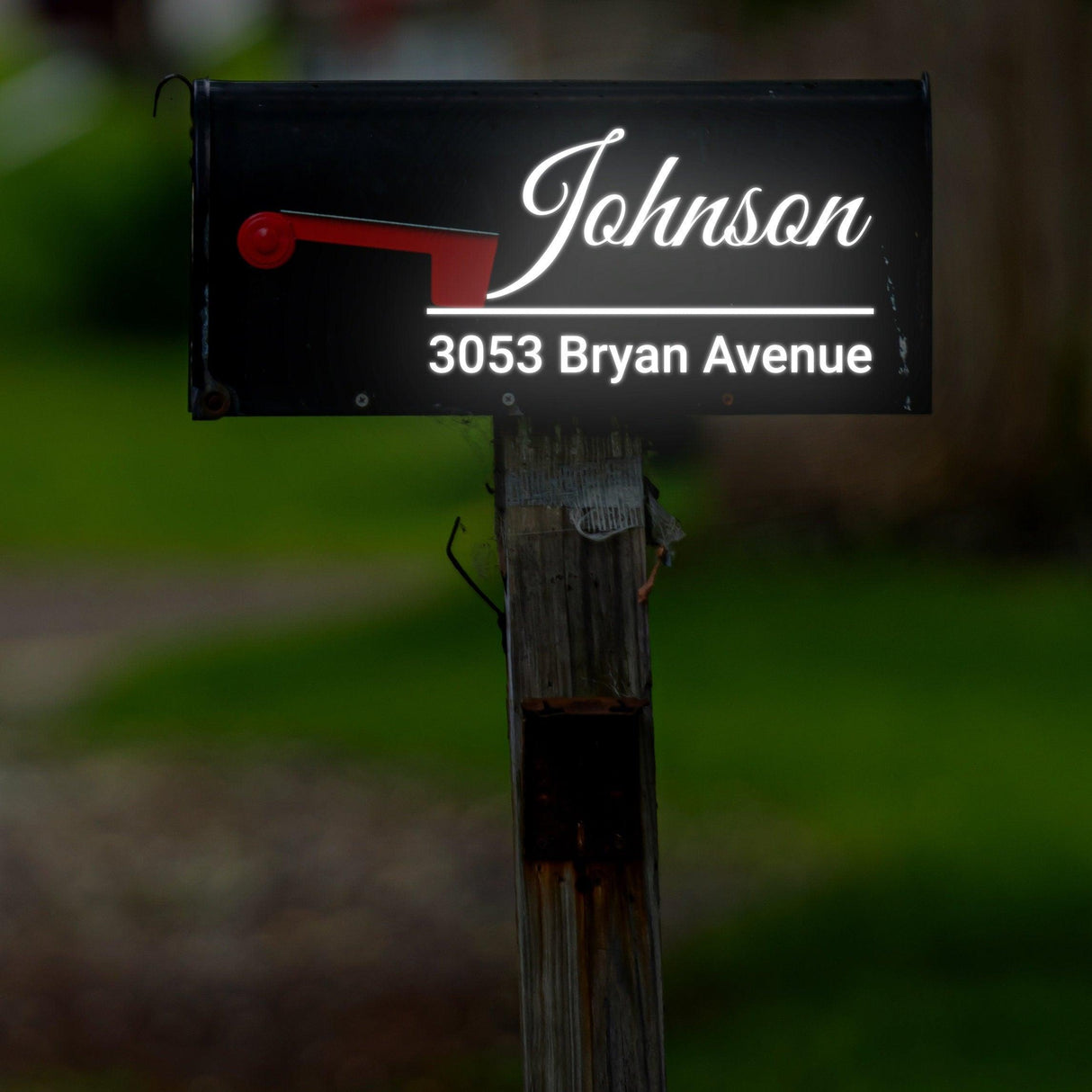 Personalized reflective mailbox decal displaying "Johnson, 3053 Bryan Avenue" for enhanced visibility and personalization.