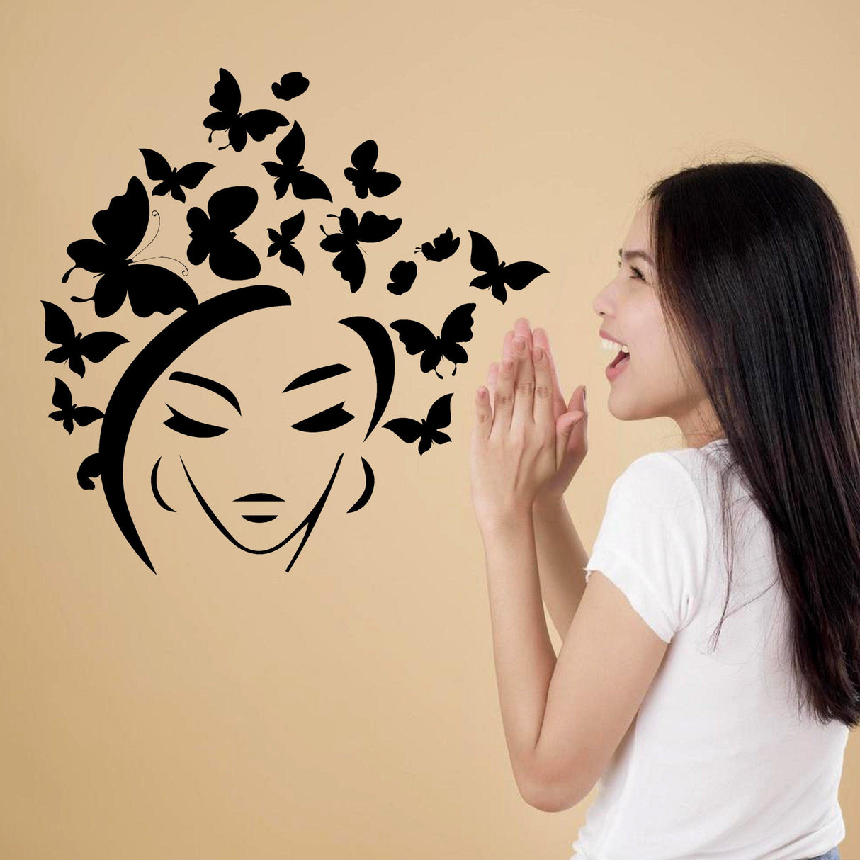 Wall decal featuring a woman with butterflies in her hair, adding a nature-inspired touch to home interiors.