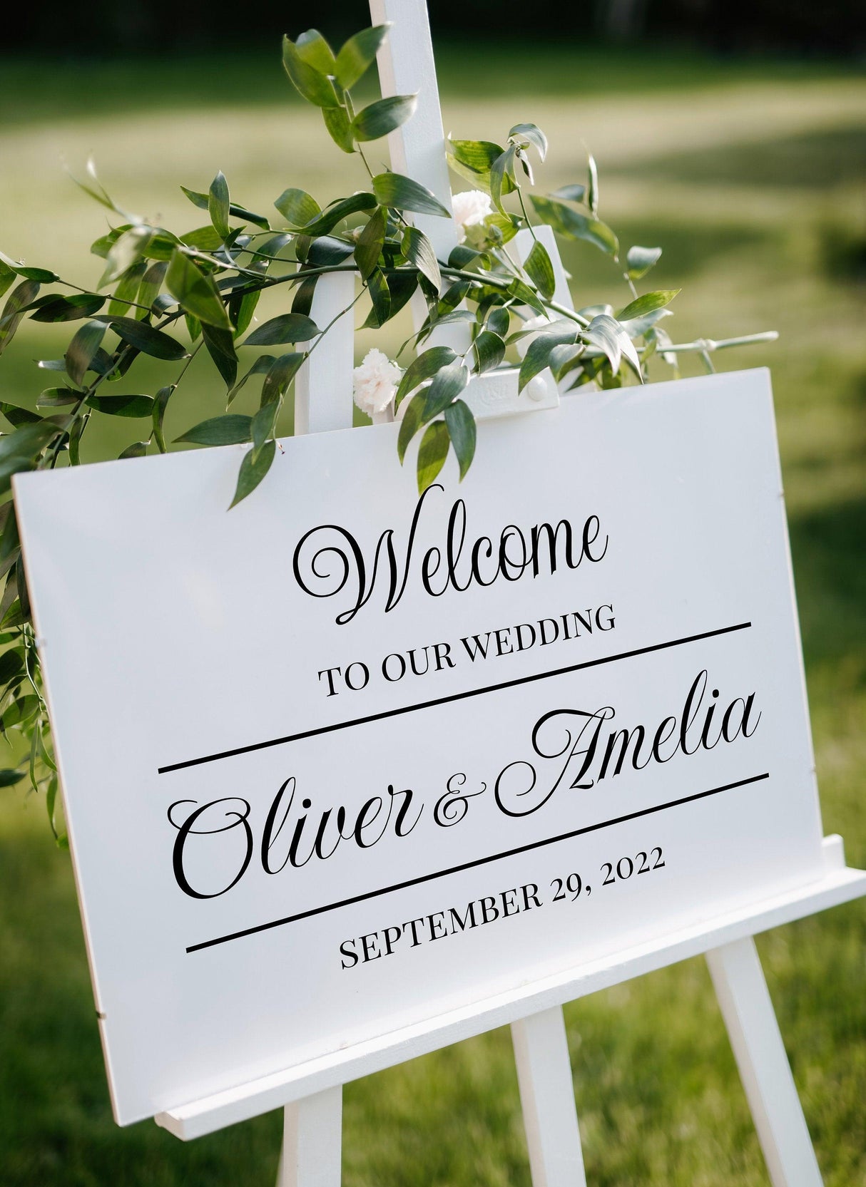 Welcome to our wedding sign for Oliver & Amelia, personalized with date September 29, 2022, displayed outdoors.
