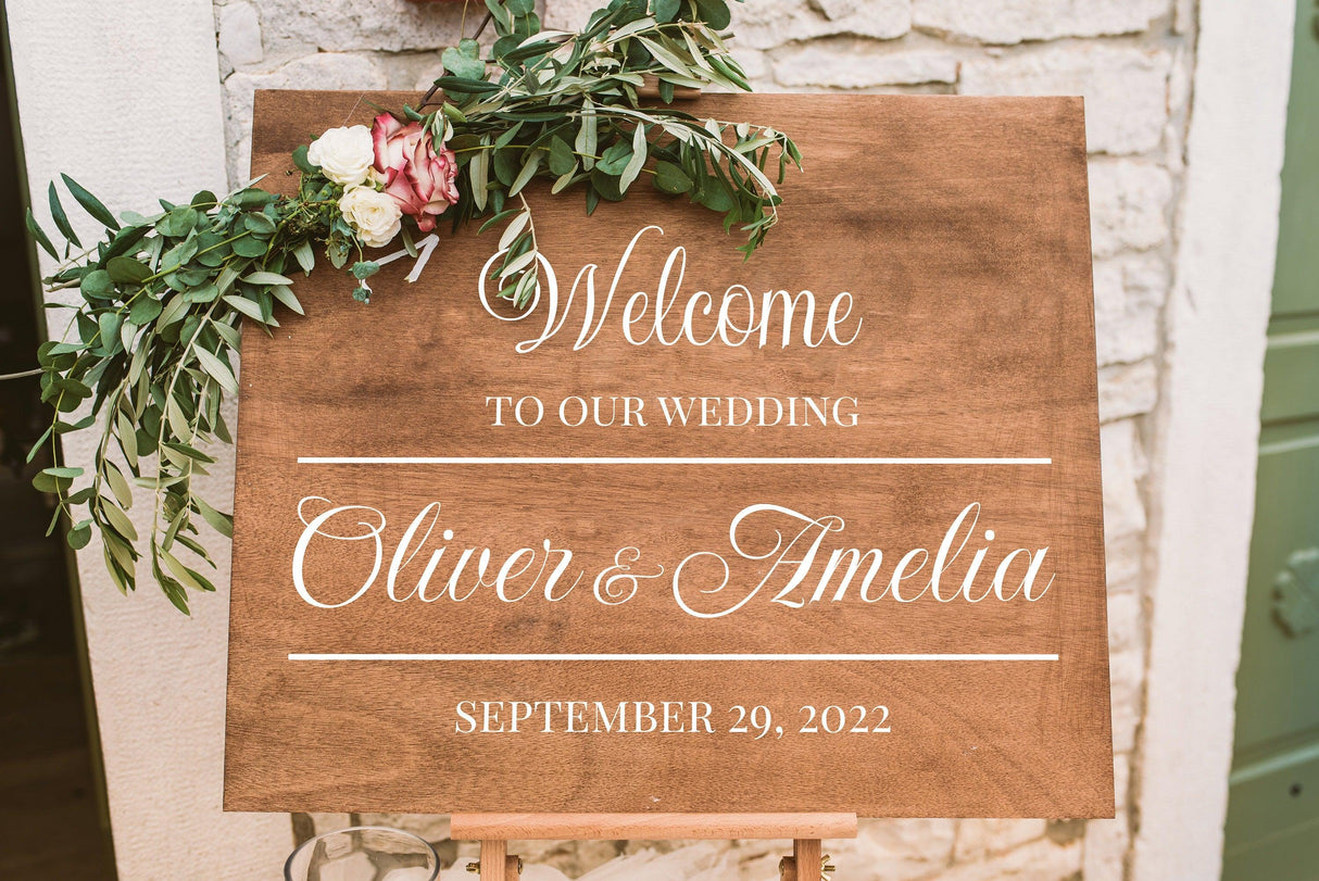 Welcome sign for Oliver & Amelia's wedding, with floral accents and date September 29, 2022.