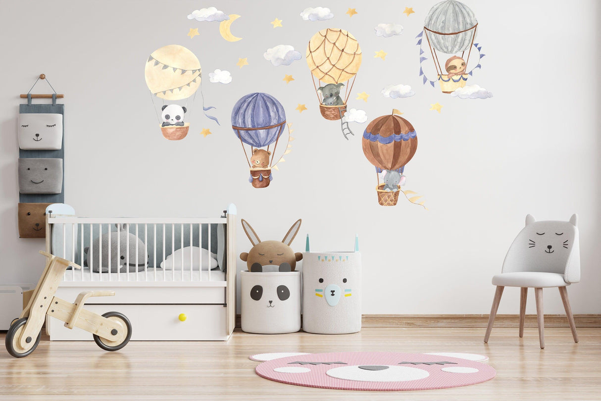 Hot air balloon wall stickers with cute animals for a whimsical nursery decor, featuring stars and clouds.