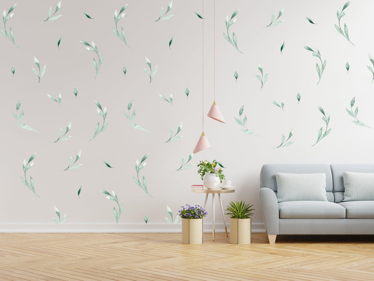 Olive botanical vinyl wall stickers creating a fresh and vibrant atmosphere in a modern living room setting.