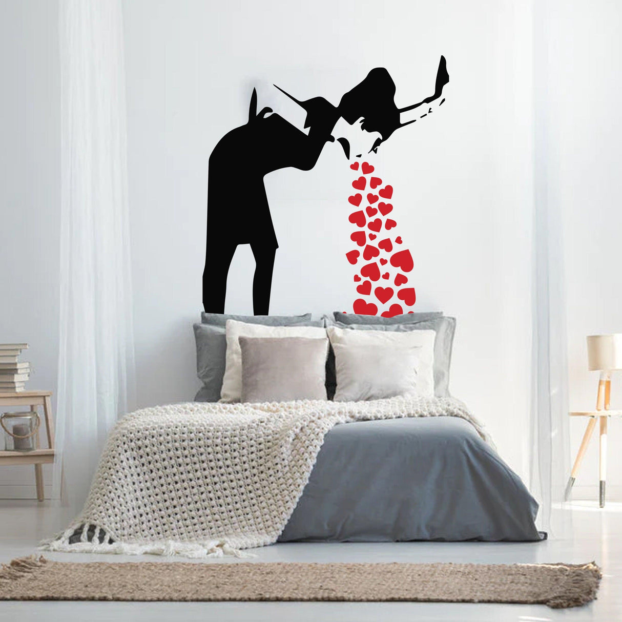 Banksy Love Sick Girl wall decal with red hearts, adding urban street art style to a modern bedroom decor.