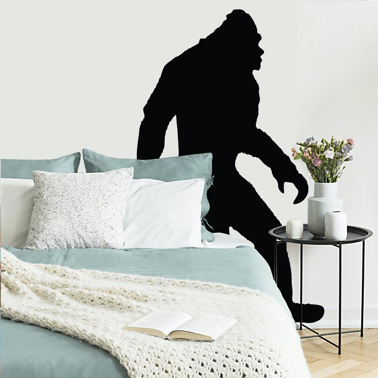 Bigfoot vinyl wall decal in a cozy living room with decorative pillows and a plant on the side table.