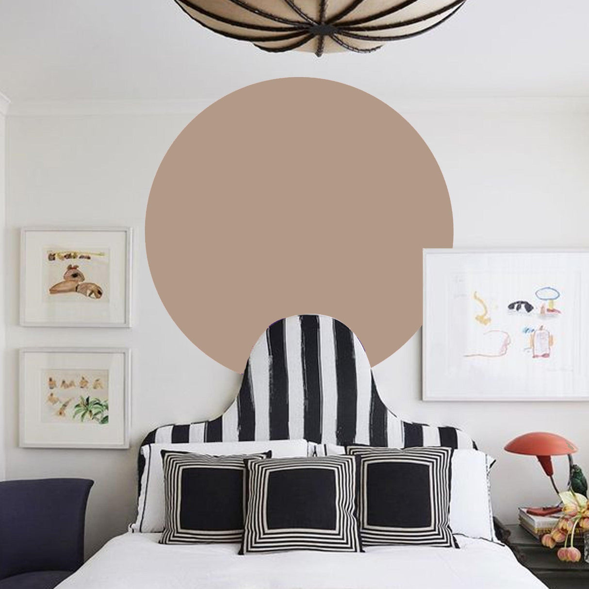 Scandinavian style circle wall sticker in a modern bedroom with striped headboard and colorful artwork.