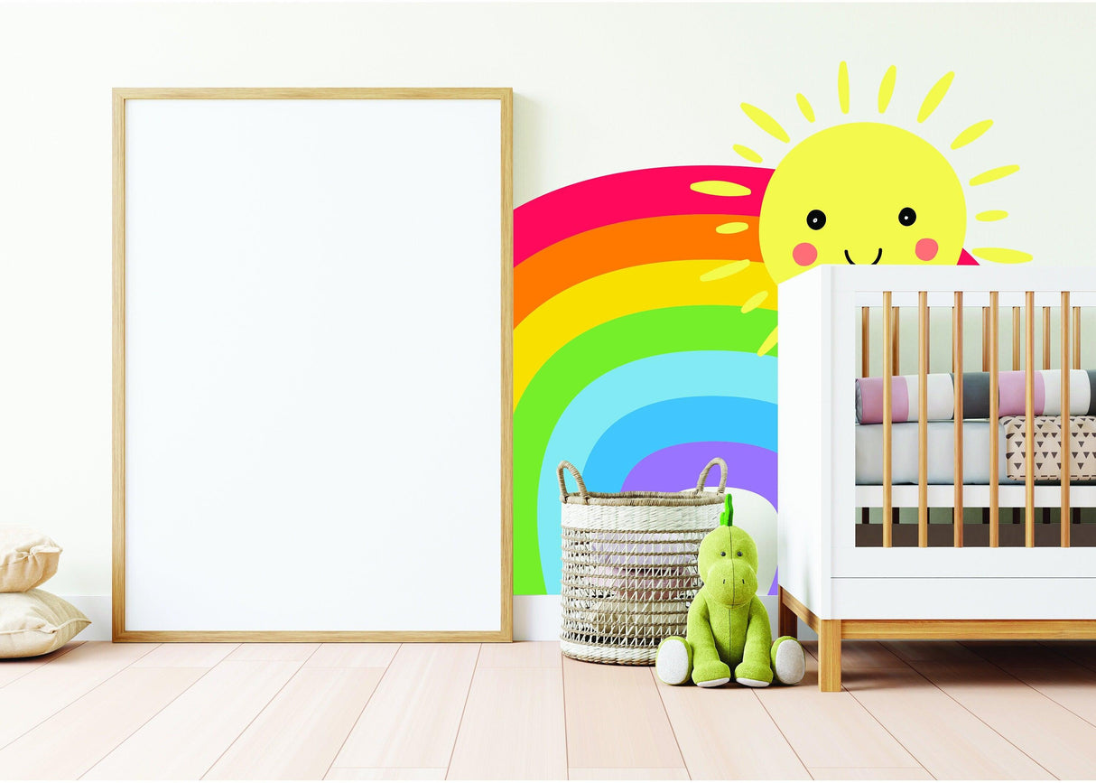 Colorful rainbow wall sticker with smiling sun in a nursery featuring a crib and plush toys.