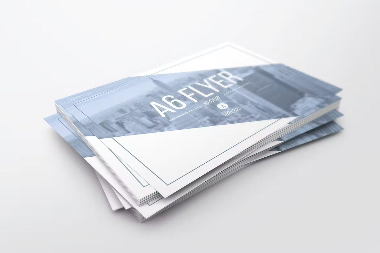 Stack of A6 custom printed flyers featuring a modern design and quality printing.