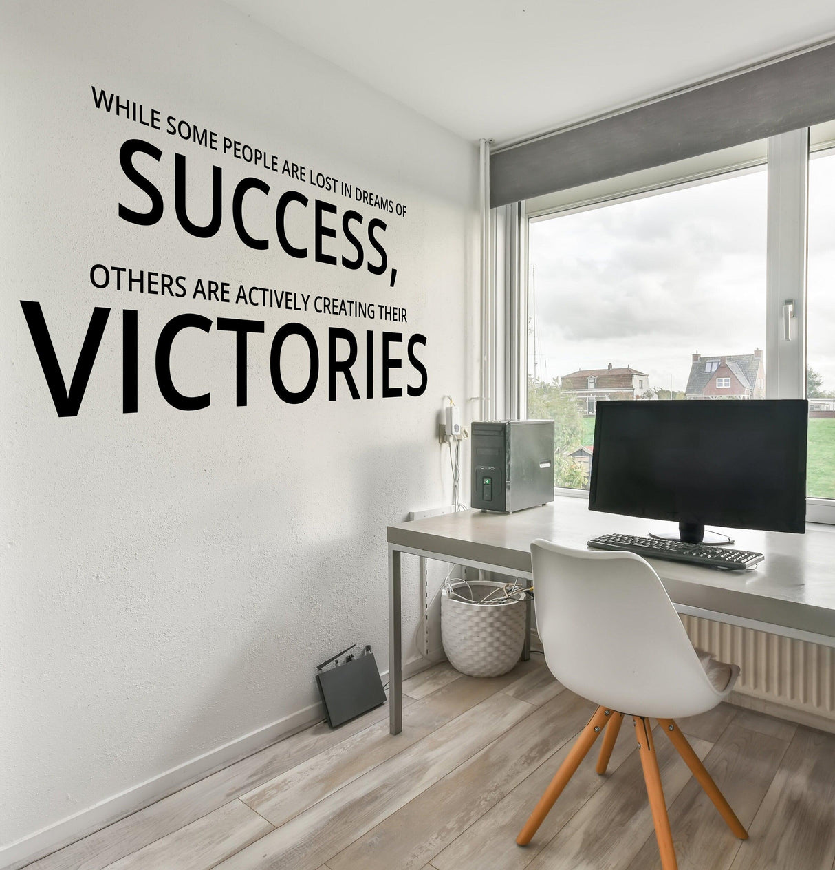 Inspirational home office wall art decal with motivational quote about success and victories in a modern workspace.