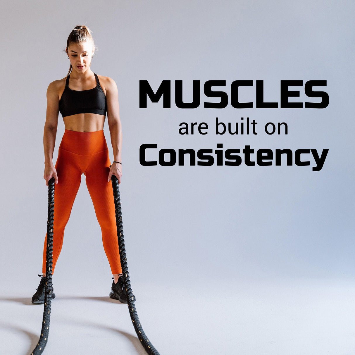 Motivational fitness decal emphasizing consistency for building muscles in a workout environment.