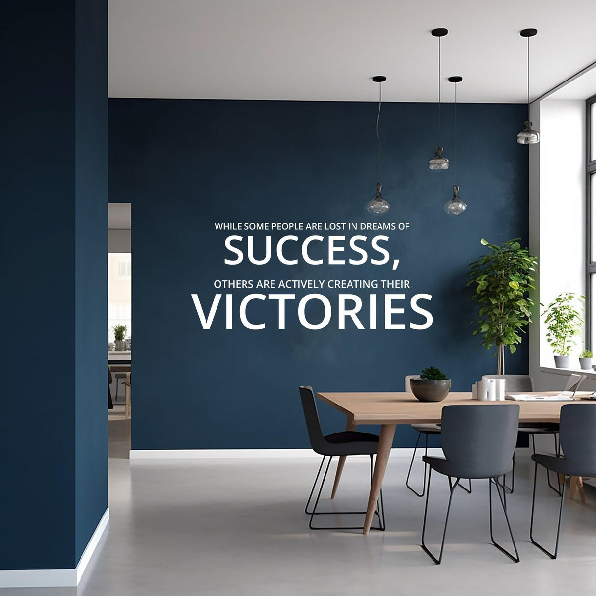 Inspirational wall decal in home office with motivational quote about success and victories on dark wall.
