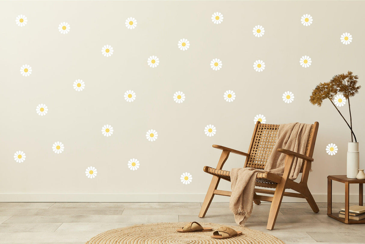 Daisy flower wall decals on a light wall, showcasing a kids room decor style with a chair and rugs.