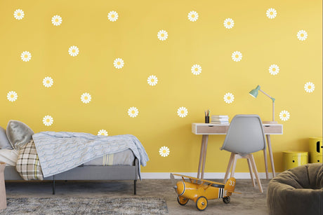 Daisy flower wall decals in a bright yellow kids' room, adding a whimsical touch to the decor.