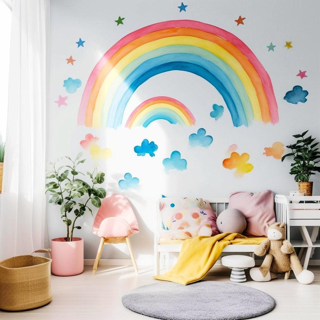 Colorful whimsical rainbow wall stickers with clouds and stars in a bright kids' room decor.