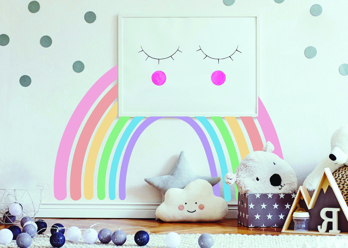 Charming Boho style rainbow wall sticker in a nursery with cute decor items, adding whimsy and color.
