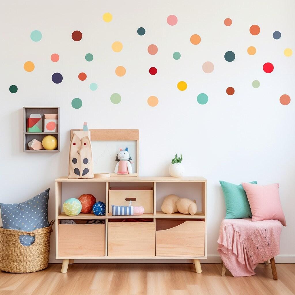 Colorful watercolor dot wall decals in a playful children's playroom featuring wooden storage and plush toys.