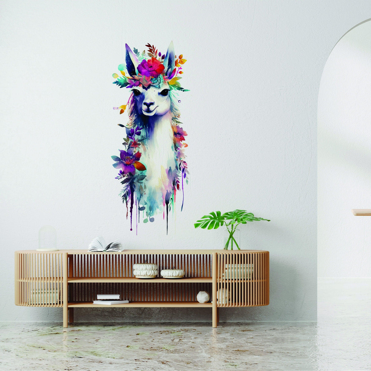 Watercolor llama wall decal with floral crown, adding charm to modern decor in a bright room.