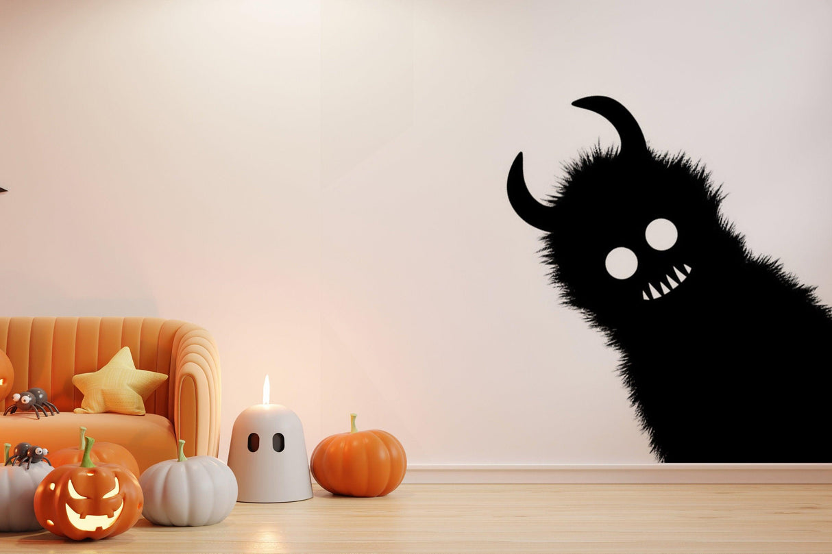 Spooky Monster Shadow Sticker on wall with pumpkins, creating a Halloween atmosphere in a cozy living room.