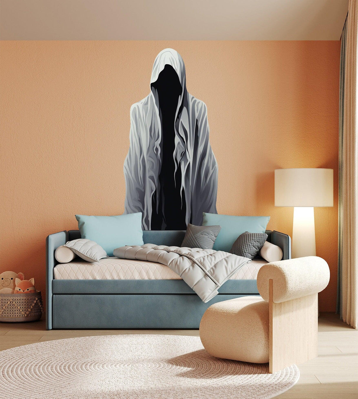 Creepy Halloween ghoul wall decal on bedroom wall above a bed with light blue bedding.