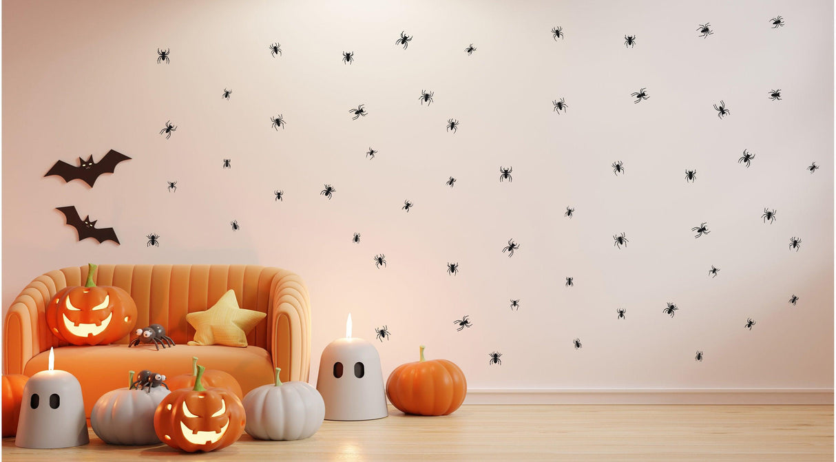 Creepy Crawly Spider Wall Decals on a Halloween-themed living room wall with pumpkins and bats.