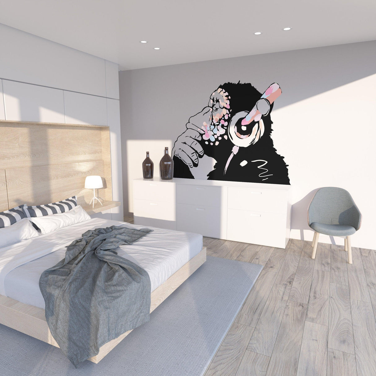 Banksy-inspired pink thinking monkey decal on bedroom wall, featuring a chimp with headphones and artistic design.