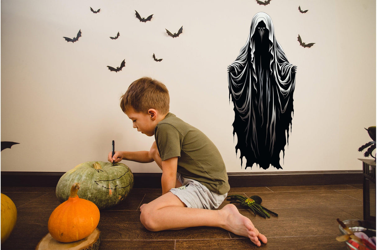 Child carving pumpkin beside Halloween Haunting Ghoul wall art decal, adding spooky decor to the festive scene.
