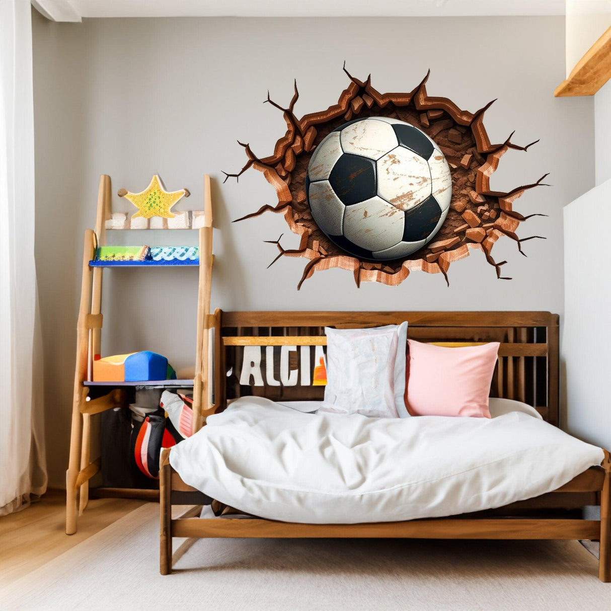 3D football wall decal breaking through wall in a stylish boys room, perfect for young sports enthusiasts.