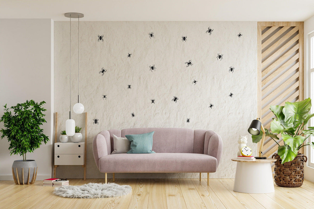 Creepy Crawly Spider Wall Decals on a textured wall above a cozy pink couch, perfect for Halloween decor.