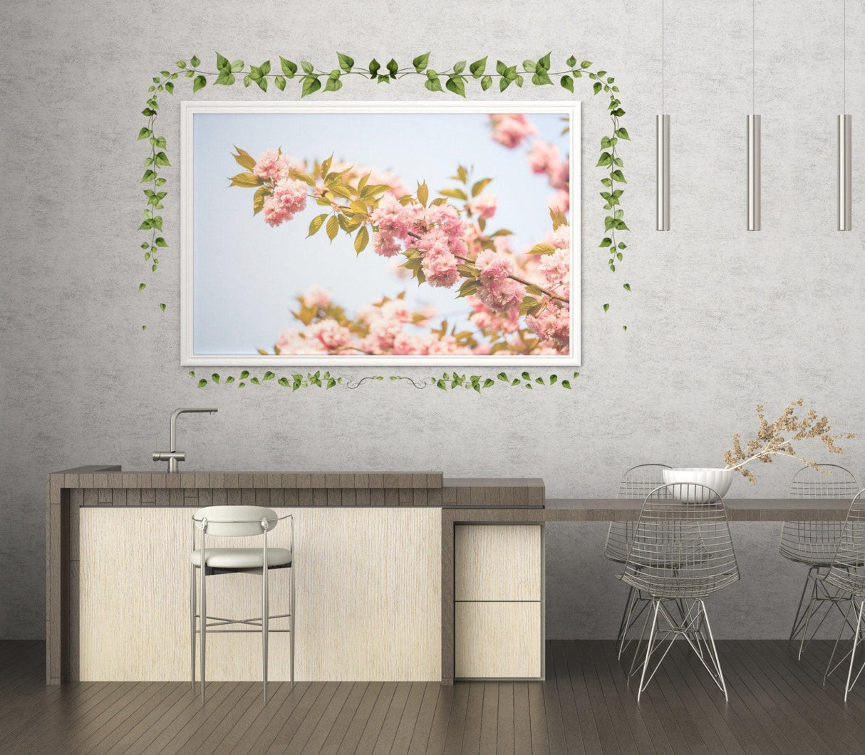 Hanging vine wall sticker with green ivy leaves around a framed floral picture in a modern kitchen setting.
